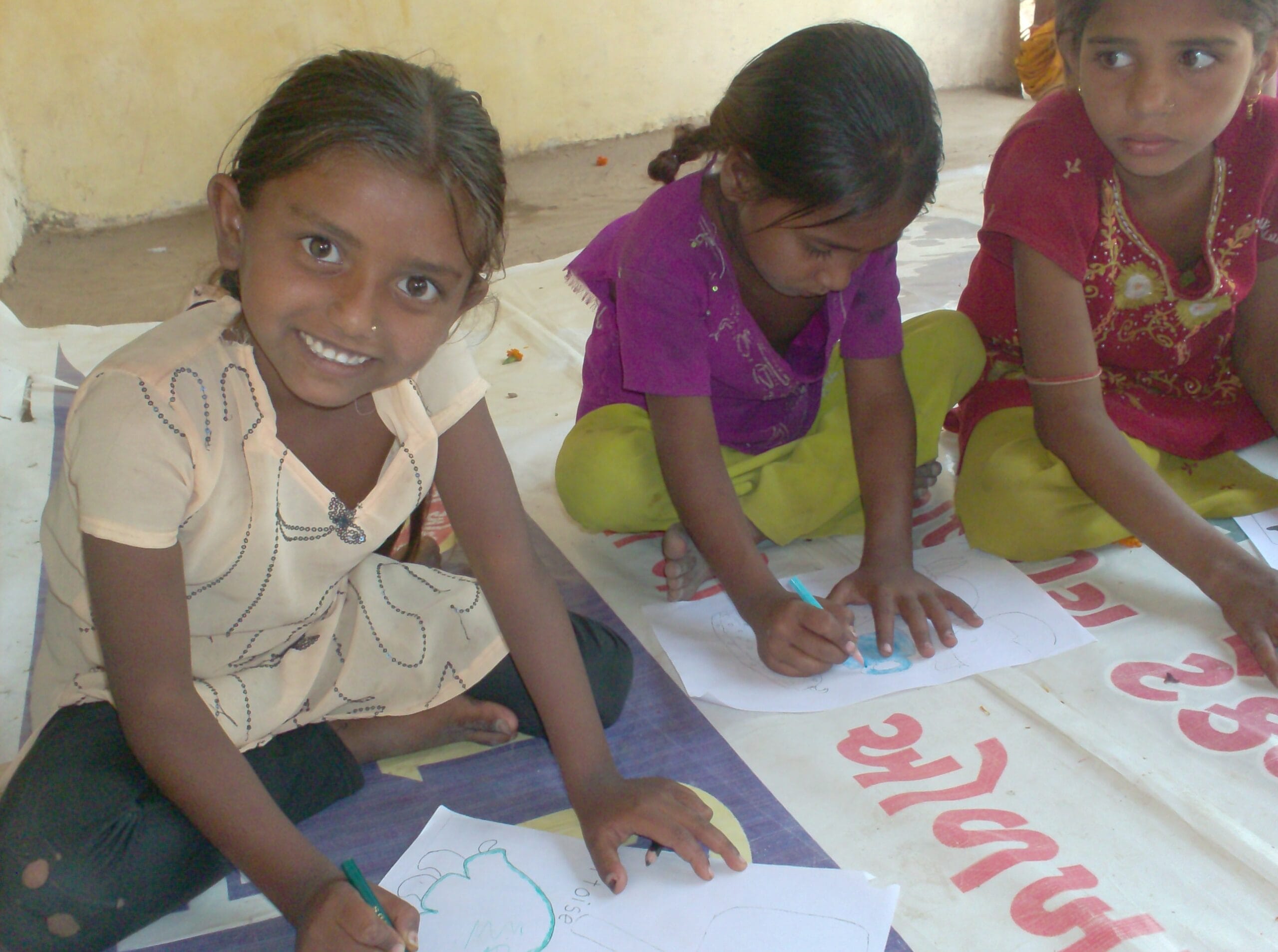 Children's clay creations displayed on the ground