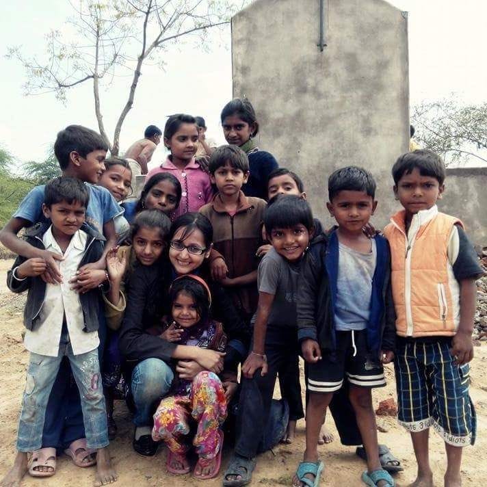 Large group of village children gathered together outdoors