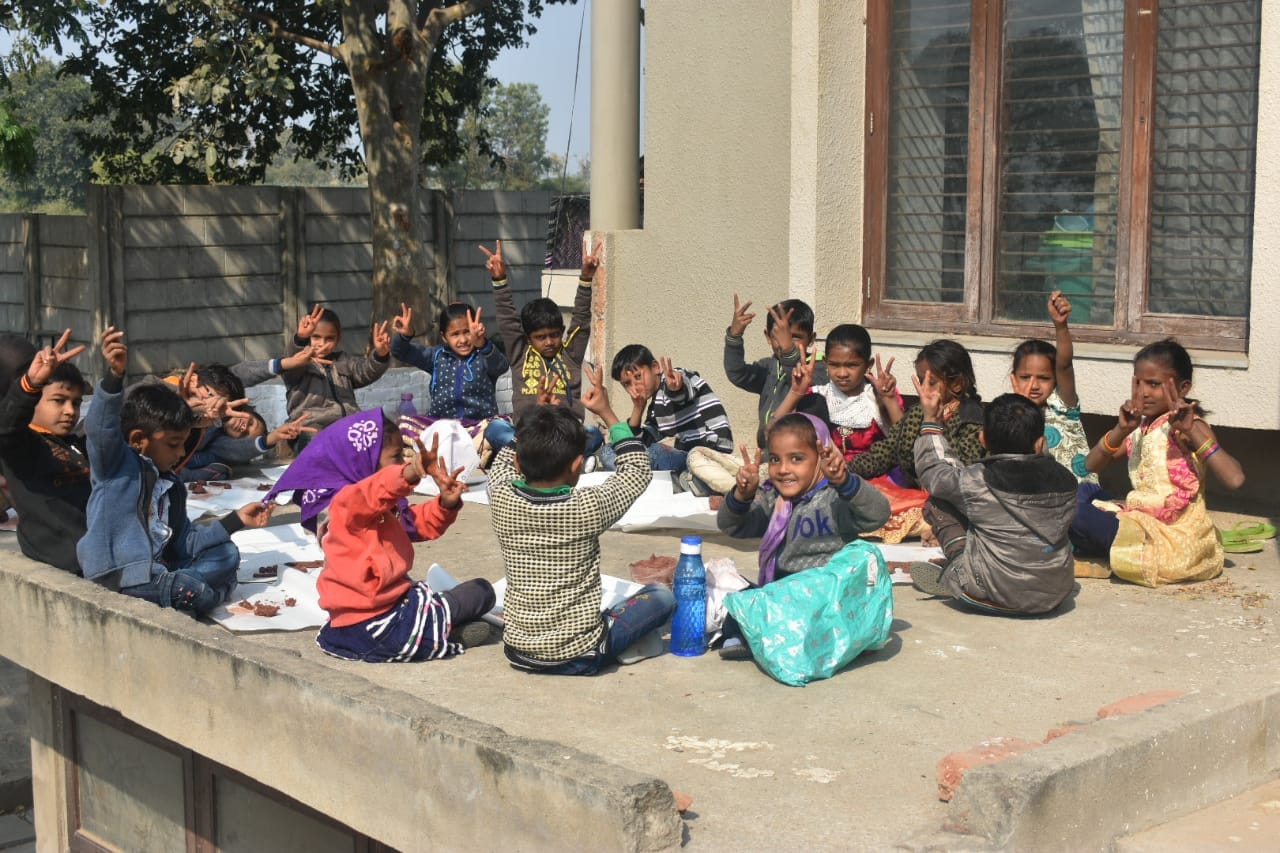 Large outdoor group session with children participating together