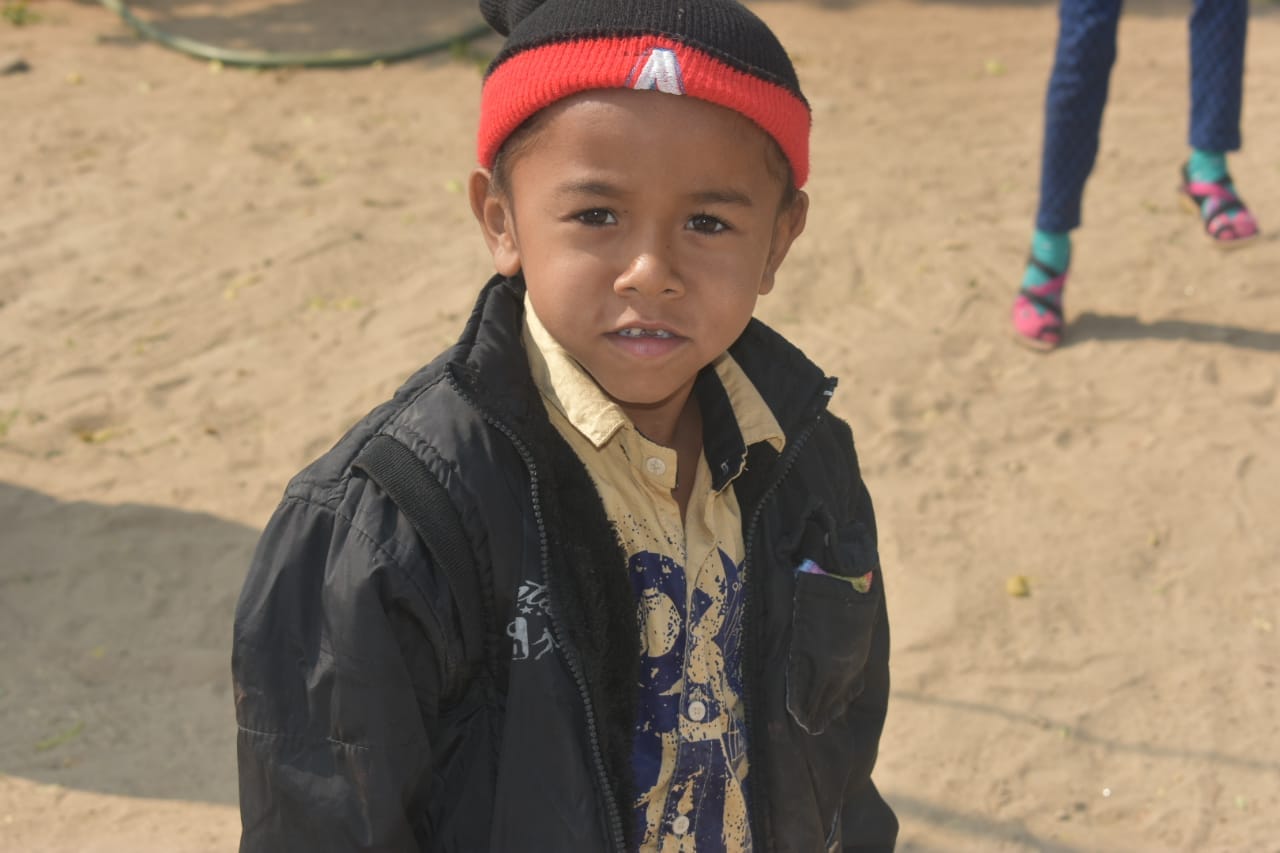 Portrait of a young child looking directly into camera